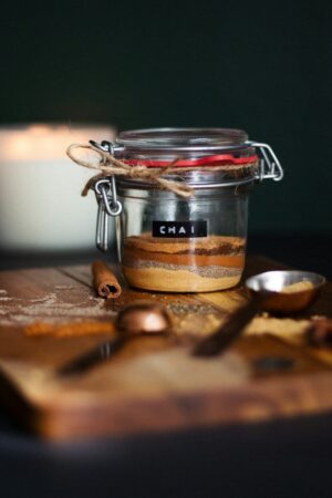Photo by Maude Frédérique Lavoie clear glass jar with brown powder on brown wooden table